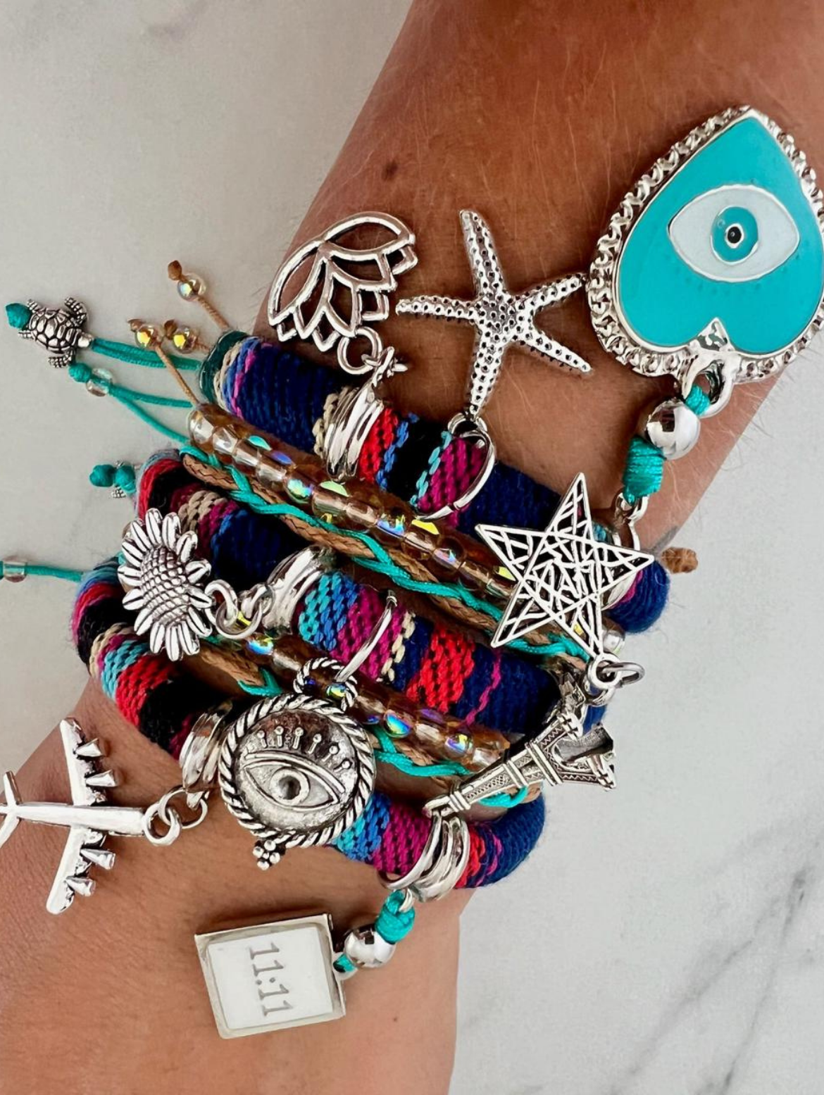 Boho multicolor bracelet with turquoise heart and ocean-inspired silver charms worn on wrist – IsabellaByShop