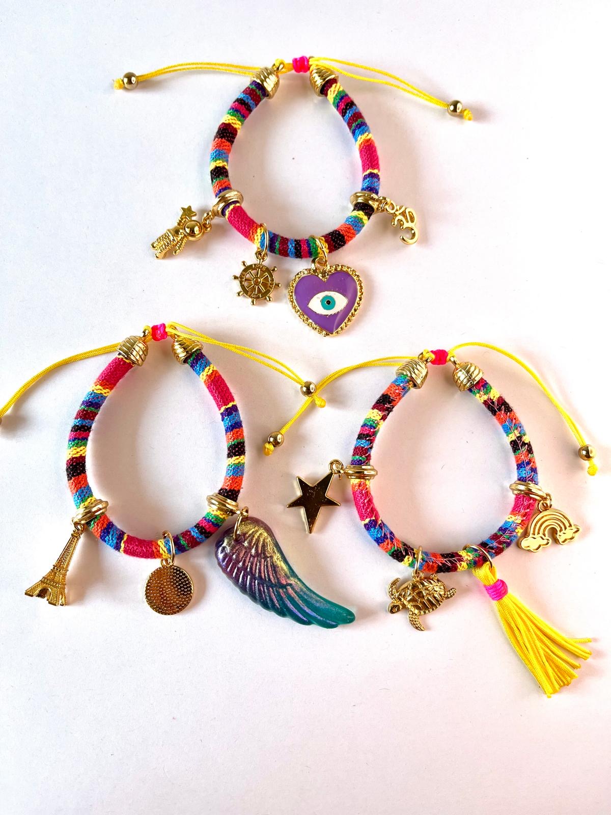 Purple heart evil eye bracelet stacked with boho bracelets on wrist, showing layering style – IsabellaByShop