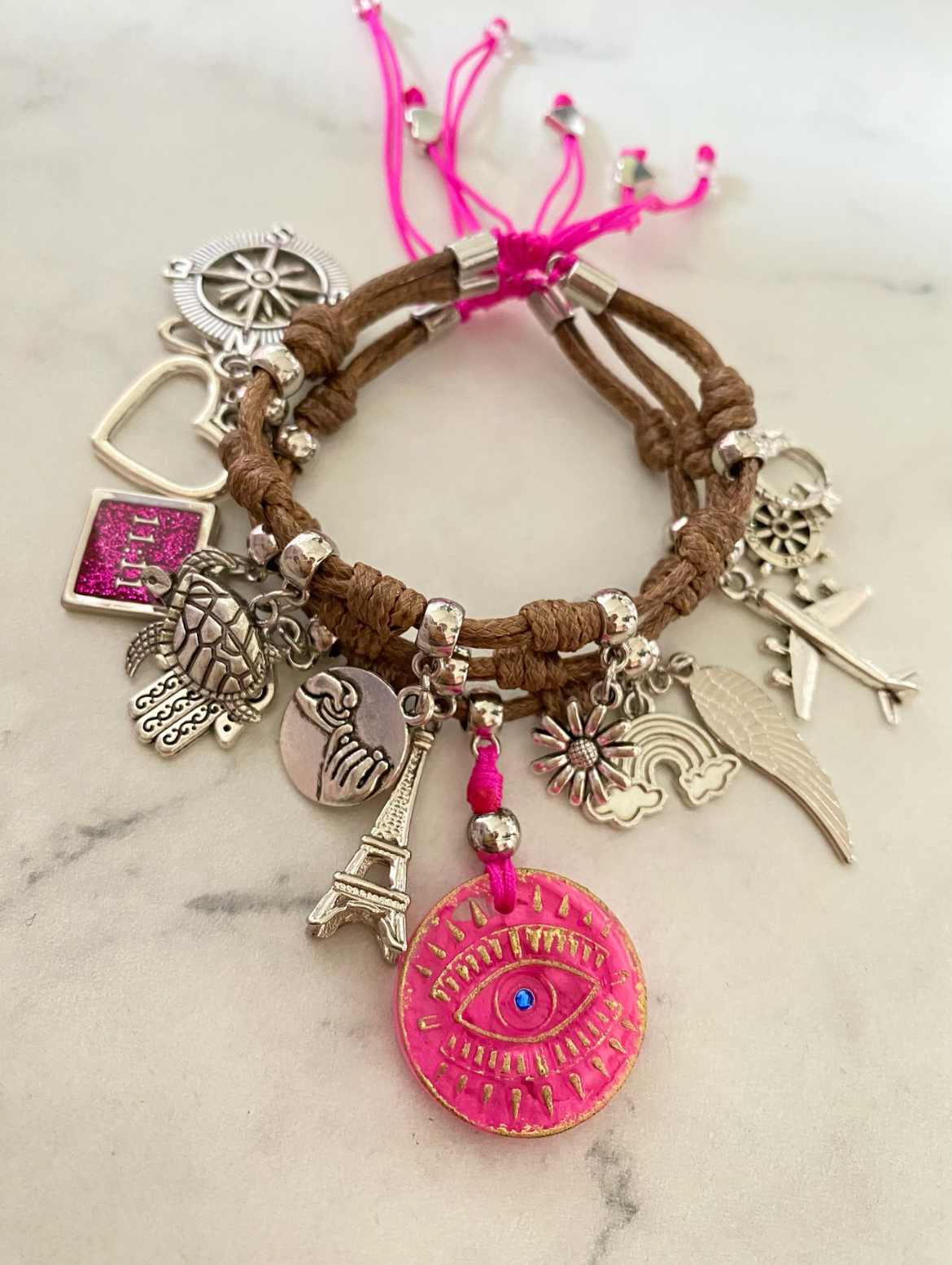 Brown Vibora Cord Bracelet with Pink Evil Pendant and Lucky Charms.