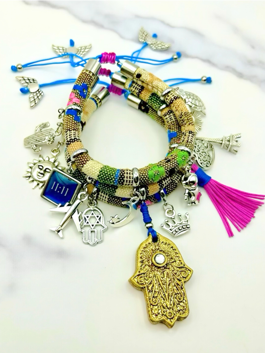 Multicolored bracelet with various charms on a white background