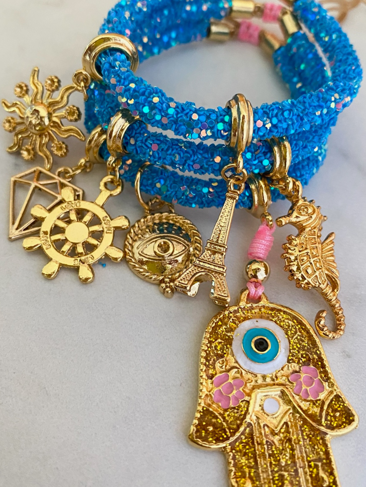 Gleaming Blue Rhinestone Bracelet with Golden Hamsa Hand and Lucky Charms