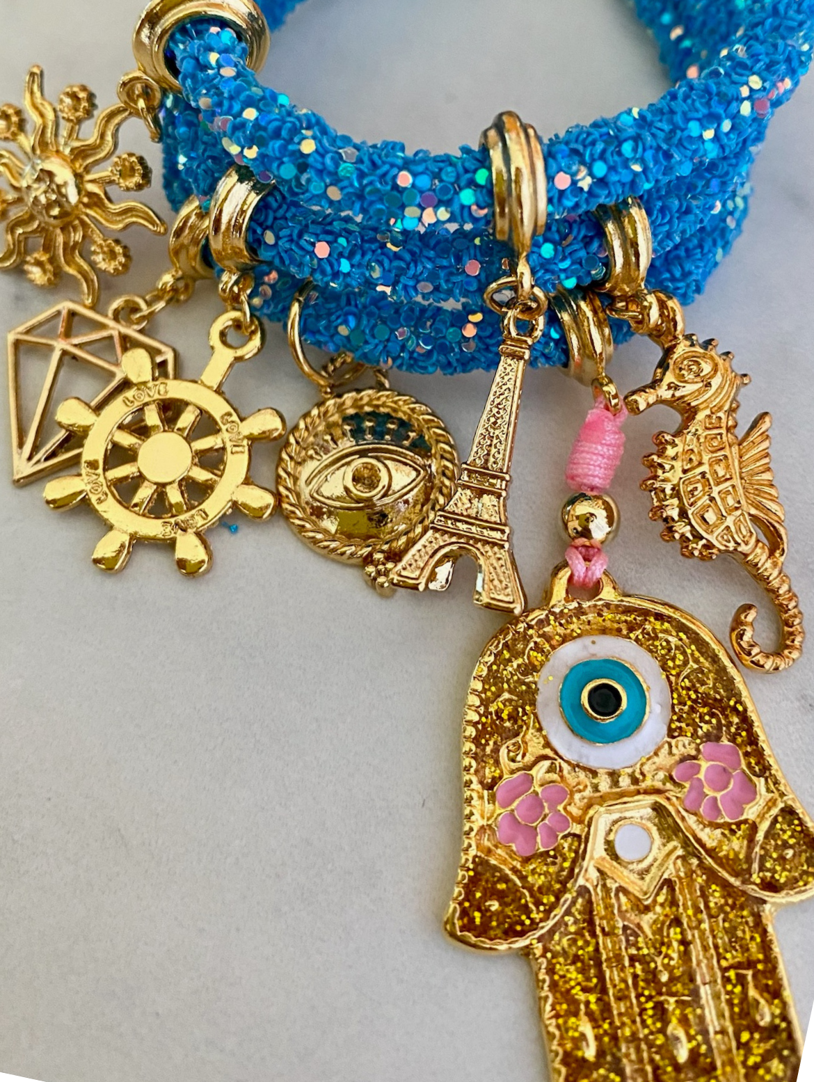 Gleaming Blue Rhinestone Bracelet with Golden Hamsa Hand and Lucky Charms