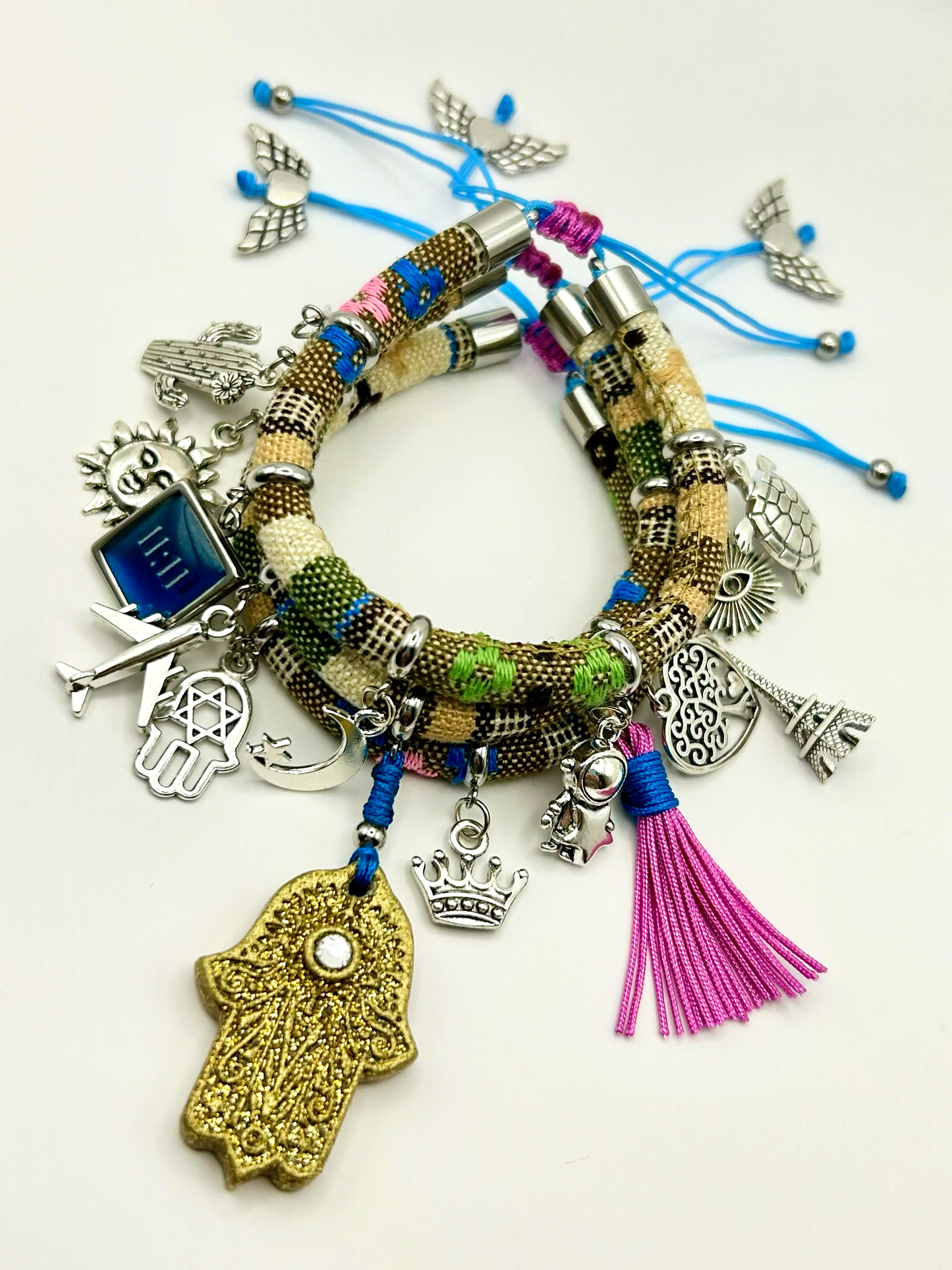 Colorful bracelet with various charms on a white background
