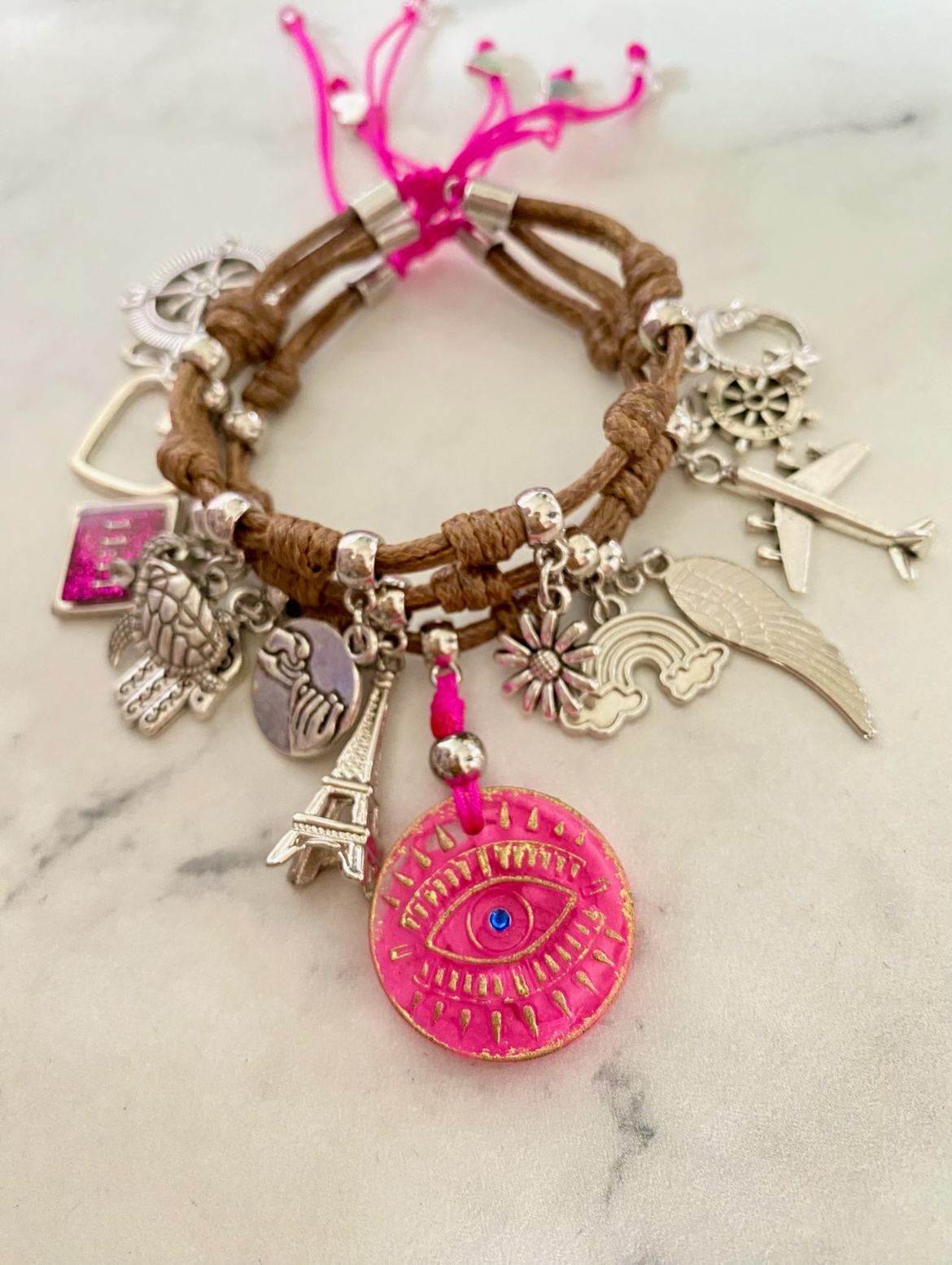 Brown Vibora Cord Bracelet with Pink Evil Pendant and Lucky Charms.