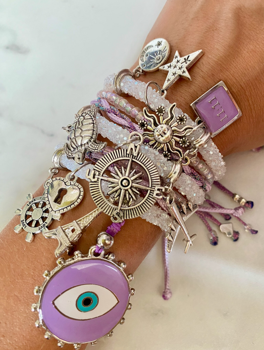 White Rhinestone Bracelet with Light Purple Beads, Purple Evil Eye and Lucky Charms.