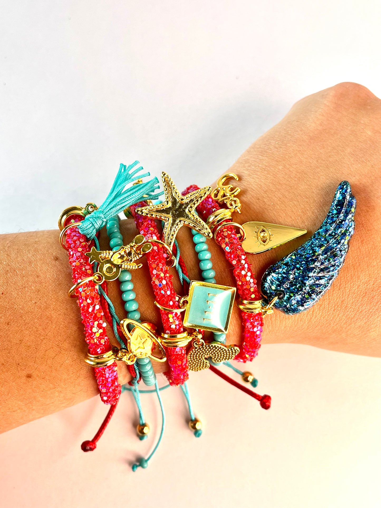 Red Rhinestones Bracelet with Turquoise Beads Cords, Lucky Charms and Neon Blue Wing