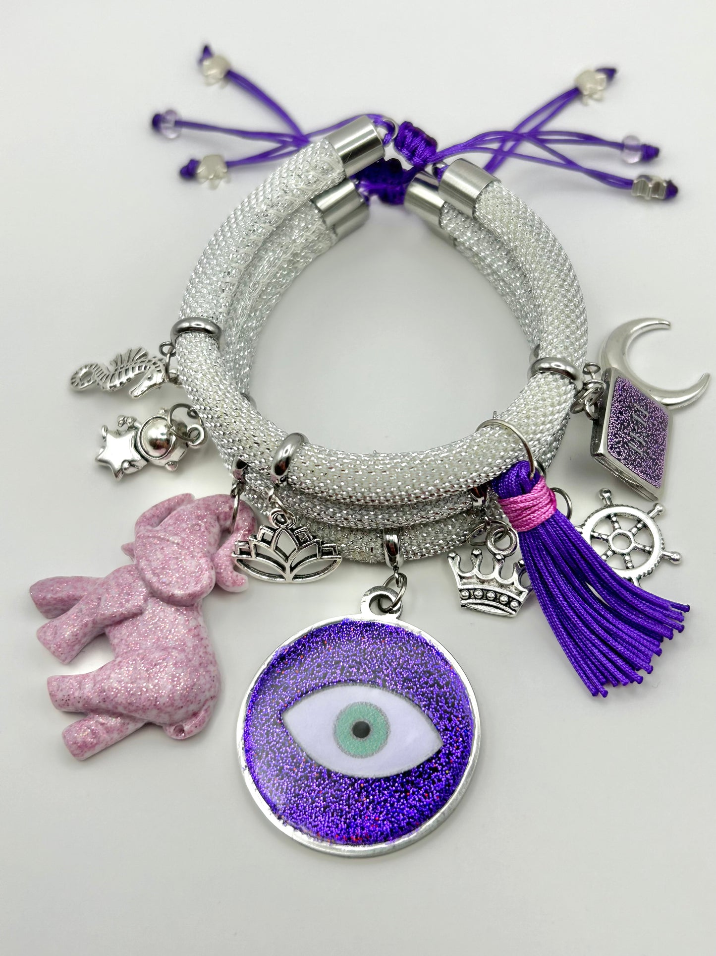 White Metallic Cord Multi-Charm Bracelet – Purple Evil Eye, Elephant & Good-Luck Symbols