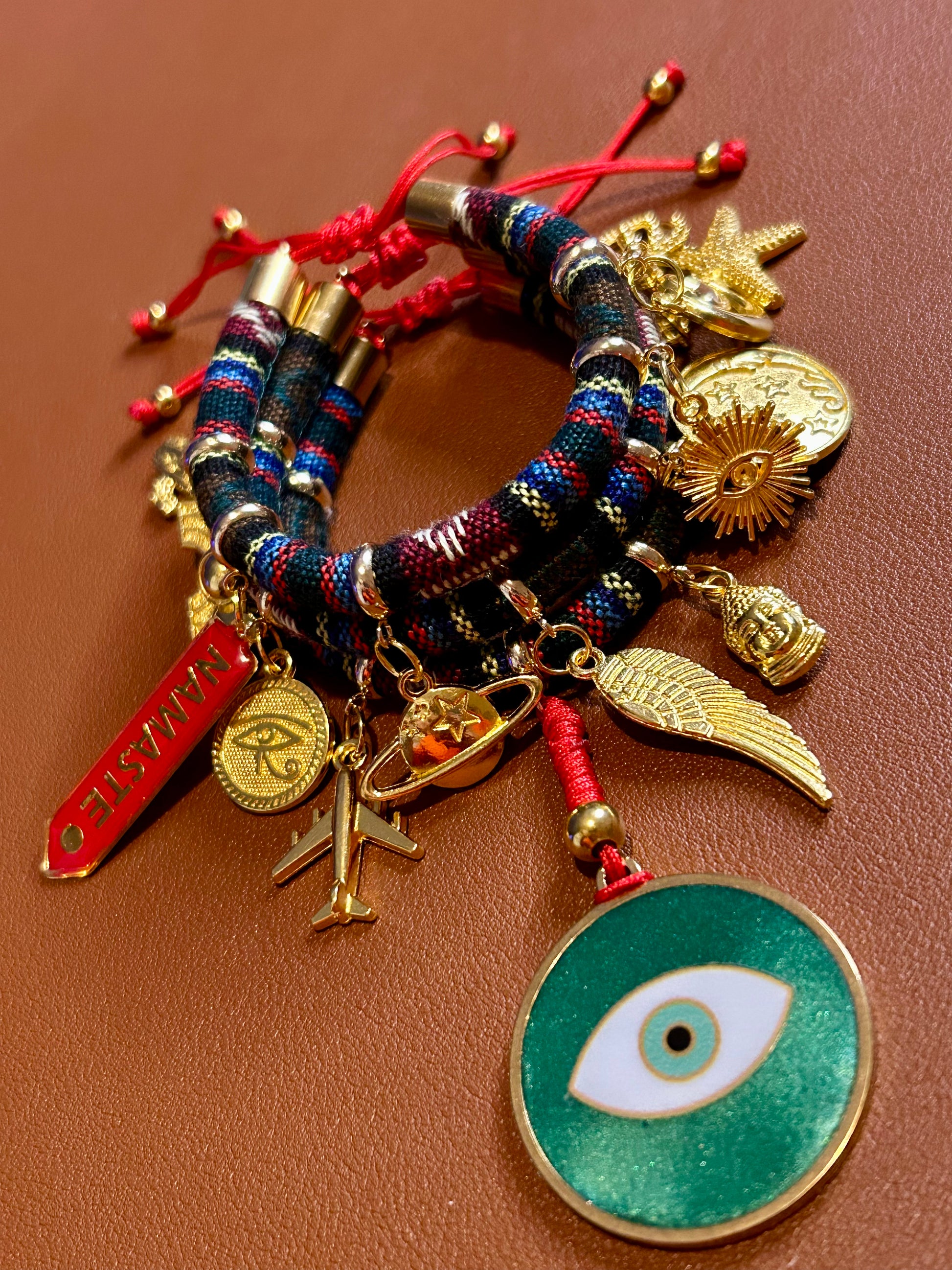Colorful bracelet with various charms on a brown background